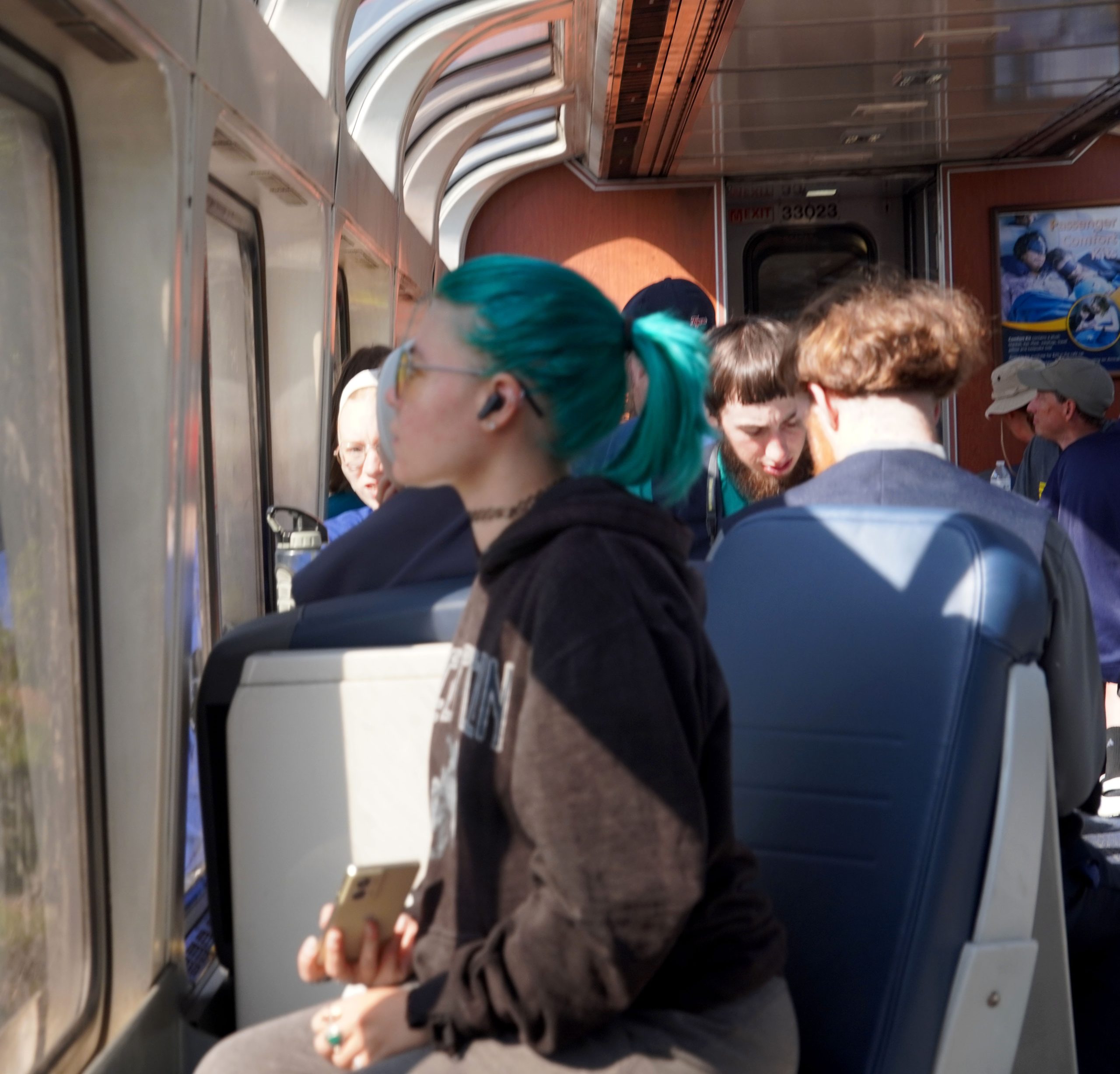 Blue hair girl and Amish family share observations.