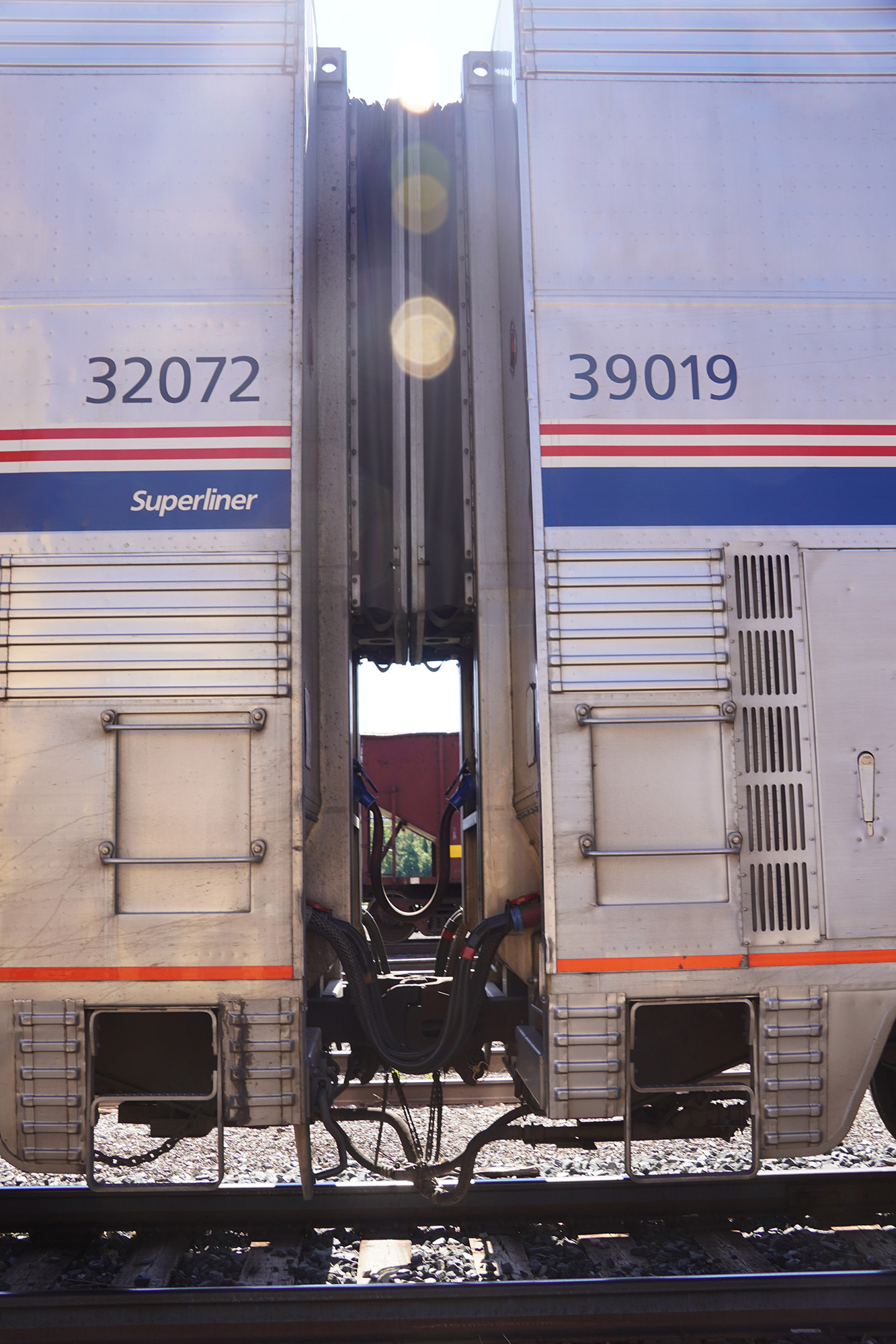 Detail showing the coupling between two amtrak cars.