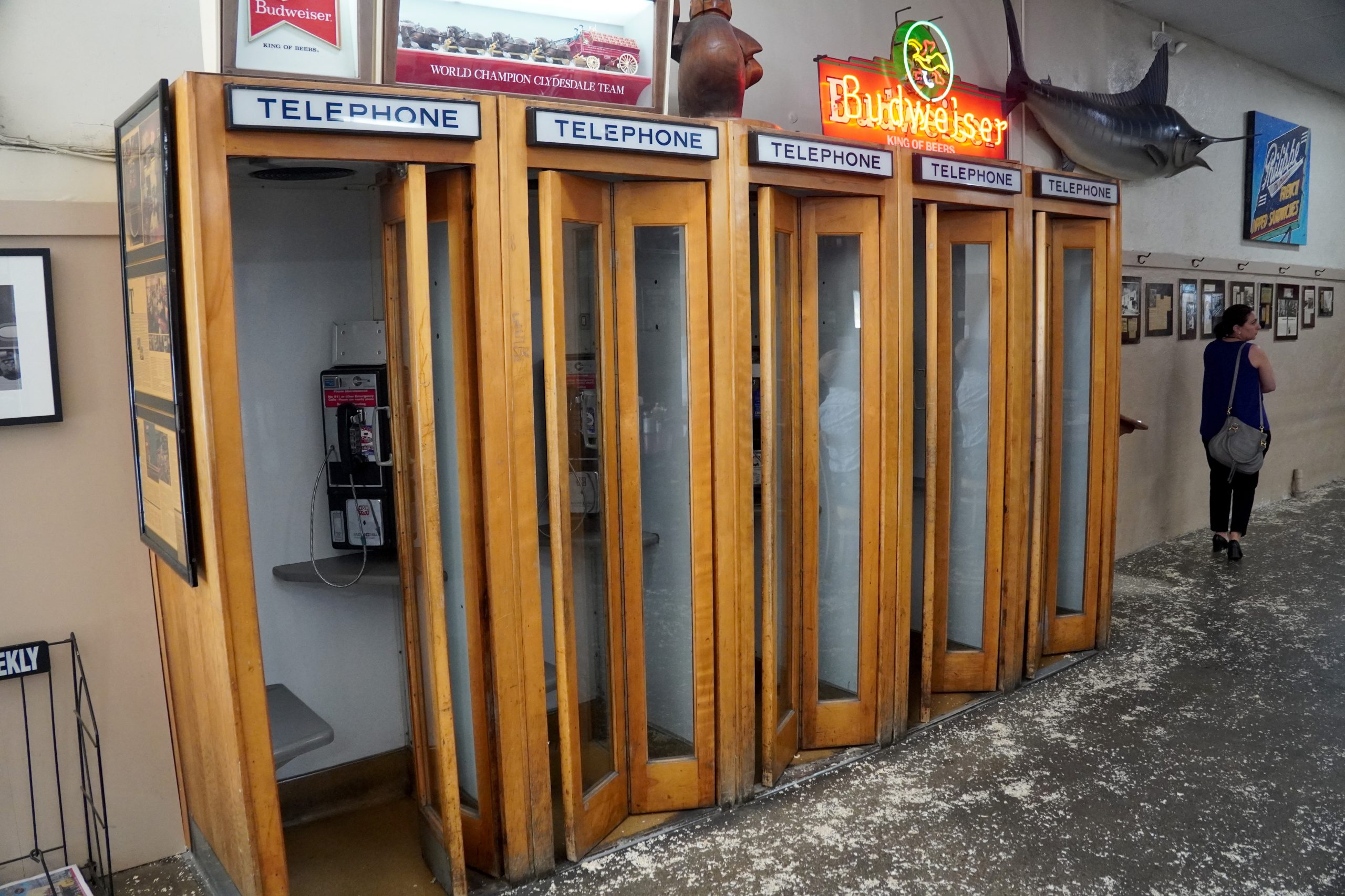 Original fixtures at Philipe the Original: wooden telephone booths and sawdust on the floor.