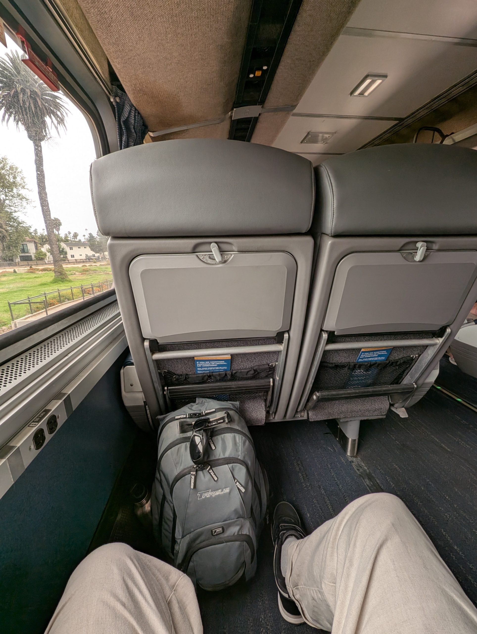View of legroom in a coach seat on Amtrak Coast Starlight.