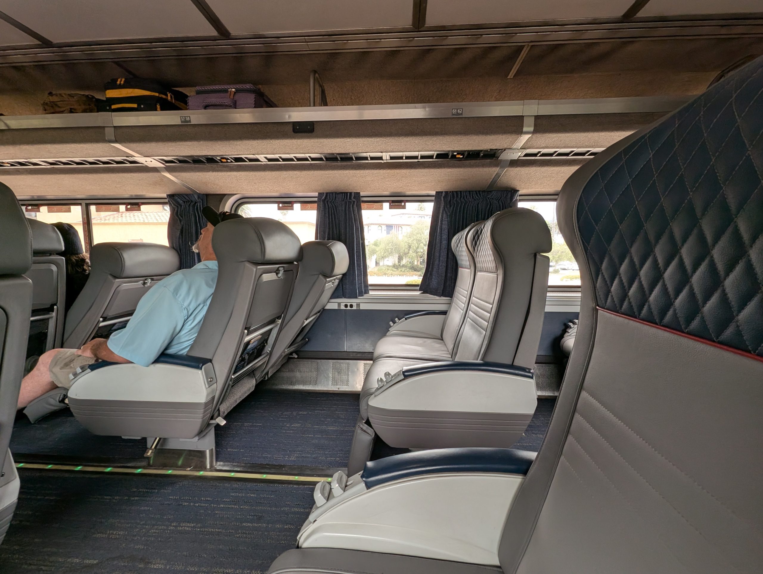 View of Amtrak coach seating from the side.