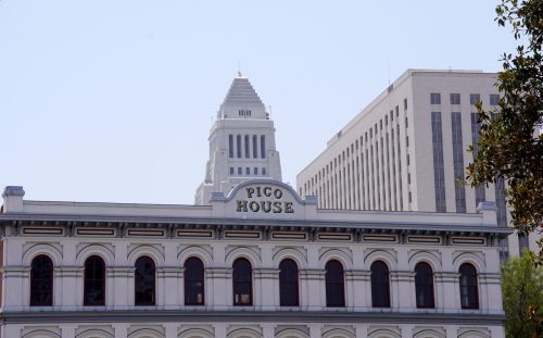 Vintage Victorian architecture with LA City Hall in the background.